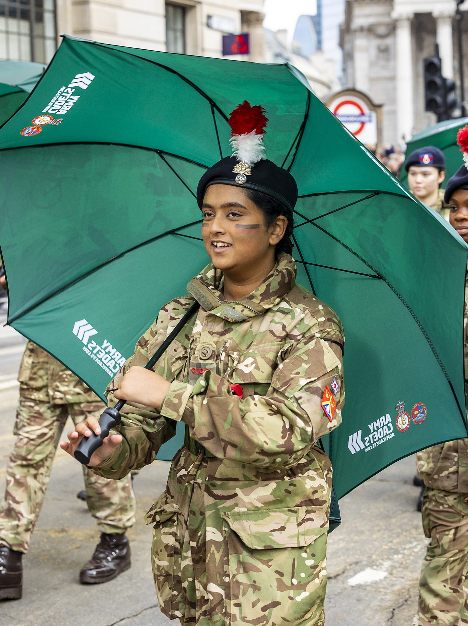 A cadet holding an umbrella during the Lord Mayor's Show 2022