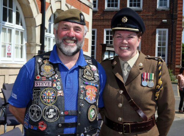 Two Reservists on Armed Forces Day taking part in the flag raising ceremony