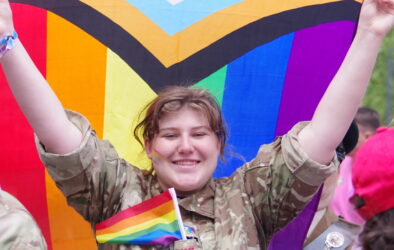A cadet holding the pride flag during the London Pride Parade 2023