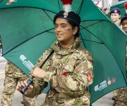 A cadet holding an umbrella during the Lord Mayor's Show 2022