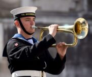 A sea cadet playing the bugle during the Lord Mayor's Cadet Music Competition